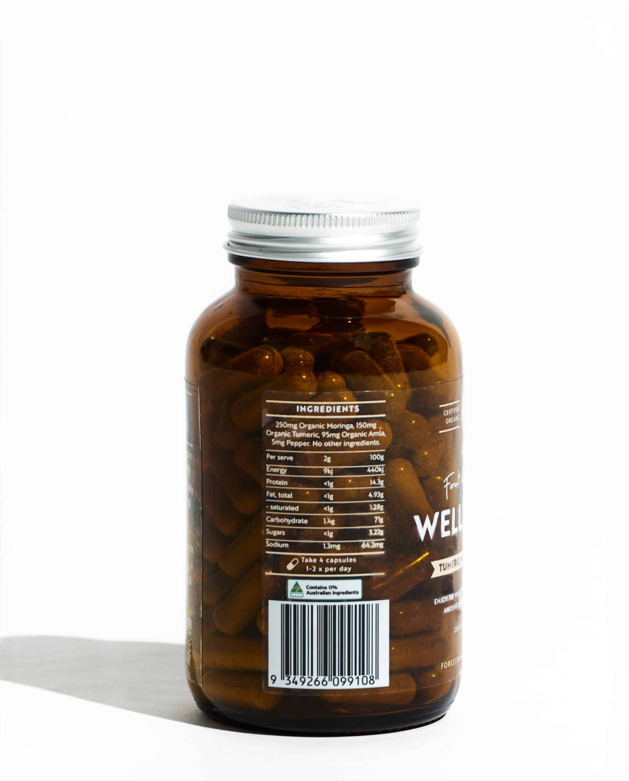 Organic Well Being Whole Food Blend amber bottle showing ingredient label with turmeric moringa and amla capsules