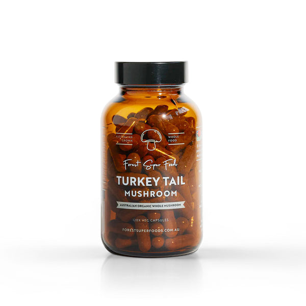 Australian Grown Turkey Tail Capsules in amber jar with whole freeze-dried mushrooms supporting gut balance by Forest Super Foods